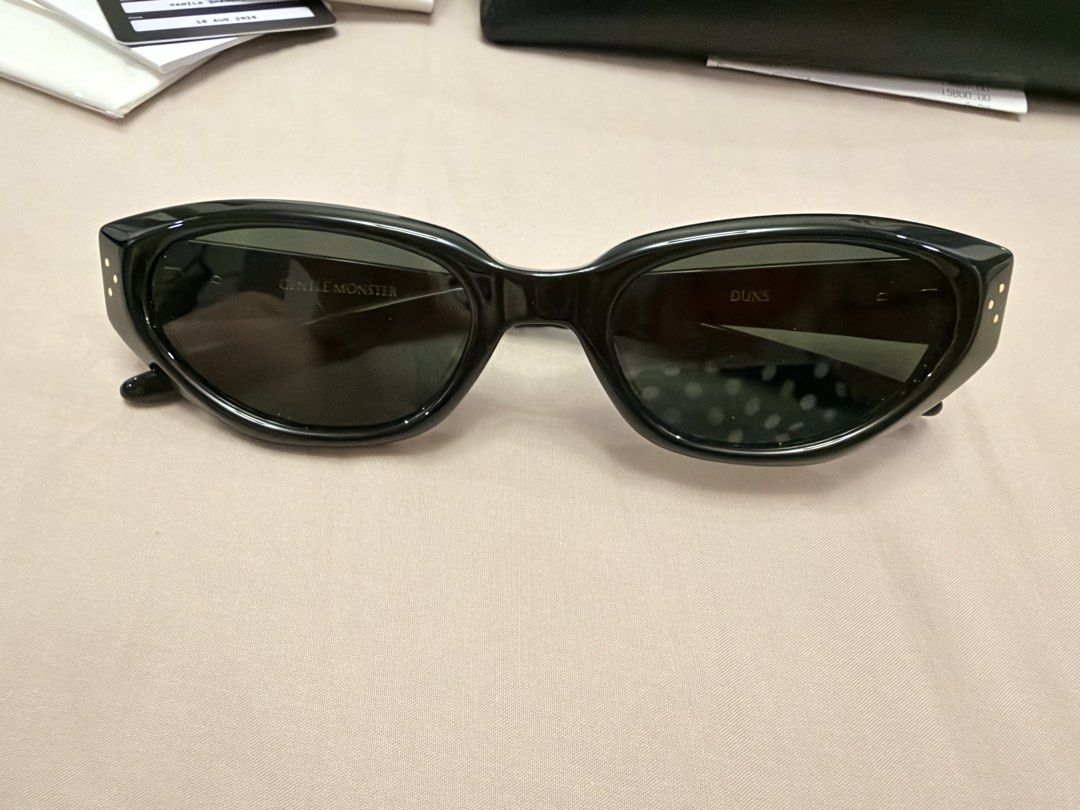 Gentle Monster Duns 01 (Category: Sunglasses & Eyewear) located in Mandaluyong City. Submitted by erykasantos (Listing ID 1469067143, Image 2). Description: Complete set with sealed warranty card. Cleaning cloth still sealed. Used 2x only. Bought just last August 2026. RFS: Bought a new one different design.