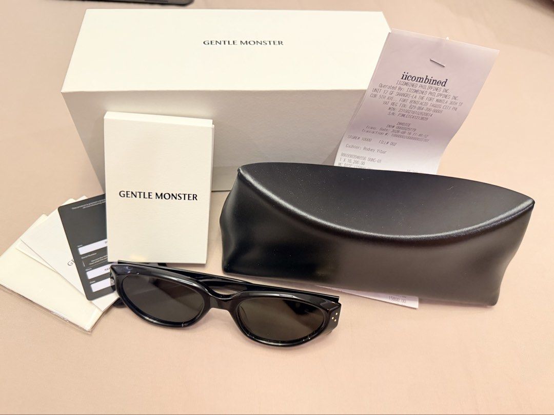 Gentle Monster Duns 01 (Category: Sunglasses & Eyewear) located in Mandaluyong City. Submitted by erykasantos (Listing ID 1469067143, Image 1). Description: Complete set with sealed warranty card. Cleaning cloth still sealed. Used 2x only. Bought just last August 2026. RFS: Bought a new one different design.