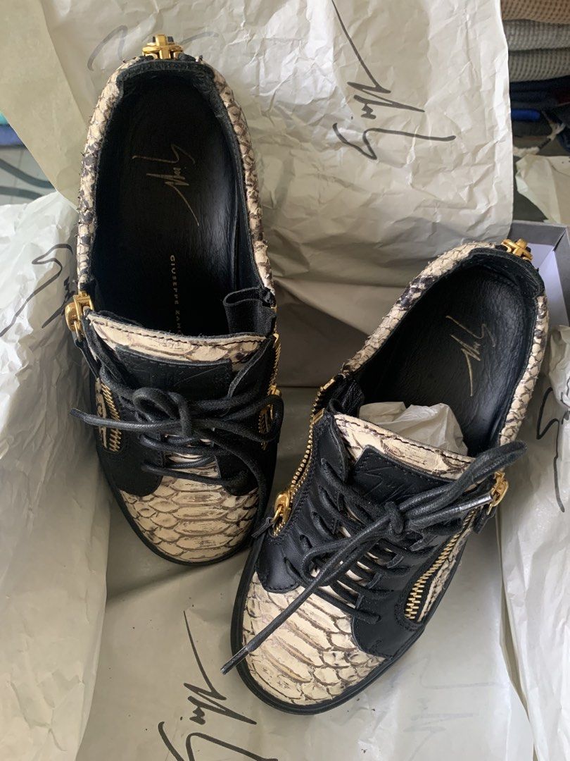 Giuseppe Zanotti Python Print Double Zip Sneakers Size 37 (Category: Sneakers) located in Pasig City. Submitted by bitofahoarder (Listing ID 1468960546, Image 3). Description: - Brand: Giuseppe Zanotti - Style: Low-top sneakers with black laces and dual gold-tone side zippers - Material: Black and white python print leather - Sole: Black rubber - Size: EU 37 (size of this brand runs small so better fits 6.5-7) - Origin: Made in Italy - Inclusions