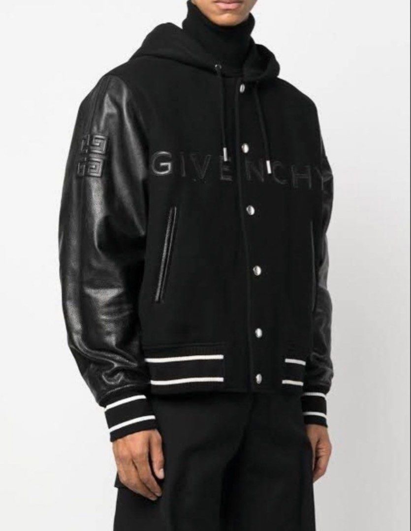 Givenchy Black Wool and Leather Bomber Hoodie Jacket (Category: Coats, Jackets and Outerwear) located in Manila. Submitted by wanwangaragesale (Listing ID 1469089082, Image 3). Description: Givenchy wool blend varsity jacket with black leather sleeves. Zip-up hood design with metallic rainbow zipper teeth. Snap button front closure, side slit pockets, striped ribbed cuffs and hem. Raised Givenchy lettering across the chest and embroidered logo pa
