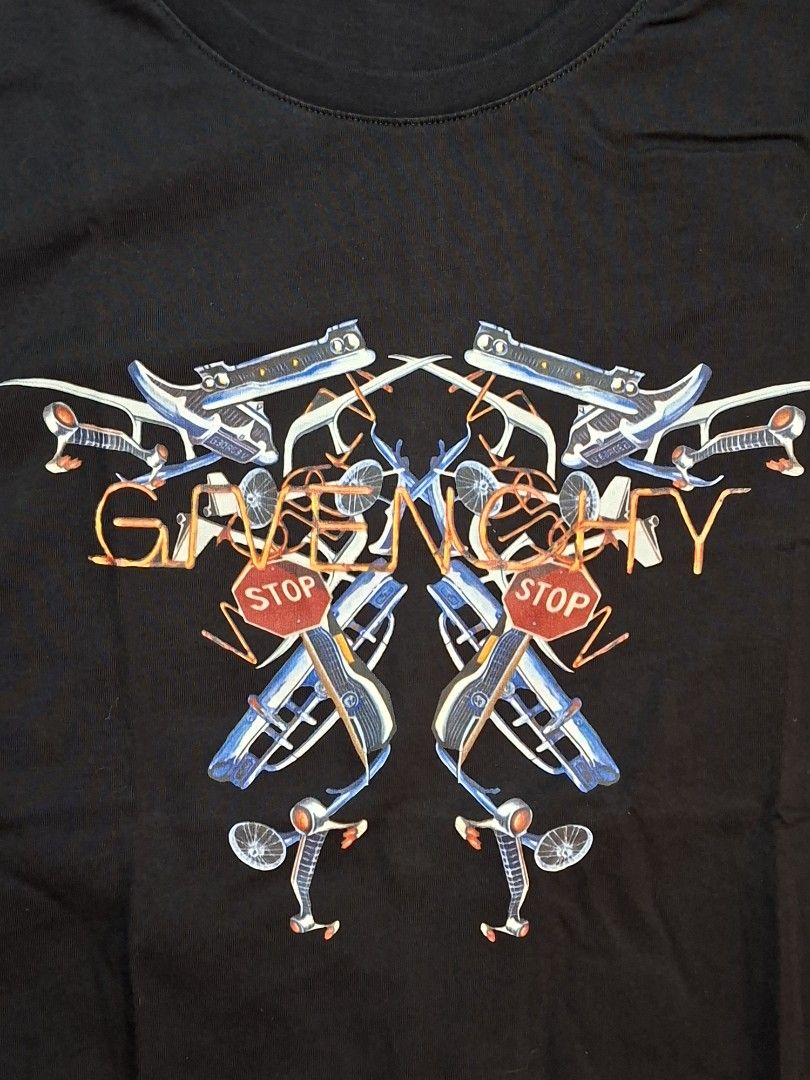 Givenchy Paris Black Graphic T-Shirt Size M (Category: Activewear) located in Baguio. Submitted by restyrille77846 (Listing ID 1469071848, Image 2). Description: - Brand: Givenchy Paris - Size: 18x24 - Color: Black - Design: Graphic print on chest with bicycles, stop signs, and abstract orange line art - Details: Classic crew neckline, short sleeves, interior brand label, and care tag attached - Material: Clean and soft cotton fabric - Condition: