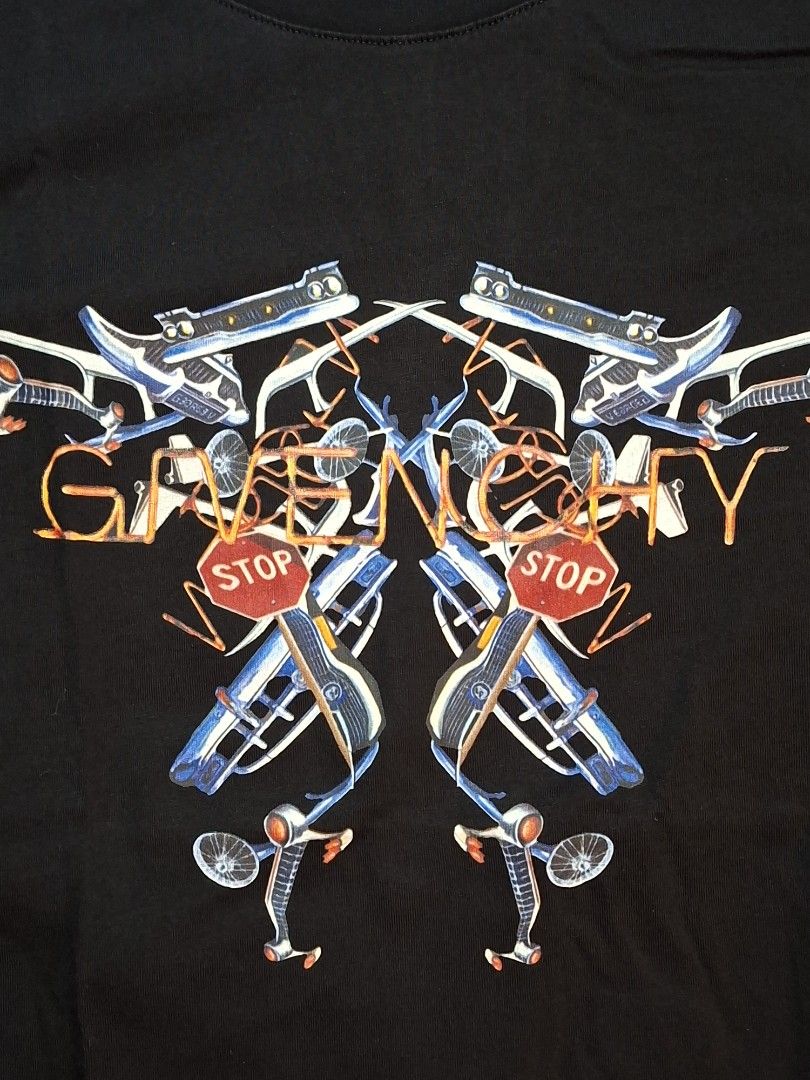 Givenchy Paris Black Graphic T-Shirt Size M (Category: Activewear) located in Baguio. Submitted by restyrille77846 (Listing ID 1469071848, Image 3). Description: - Brand: Givenchy Paris - Size: 18x24 - Color: Black - Design: Graphic print on chest with bicycles, stop signs, and abstract orange line art - Details: Classic crew neckline, short sleeves, interior brand label, and care tag attached - Material: Clean and soft cotton fabric - Condition: