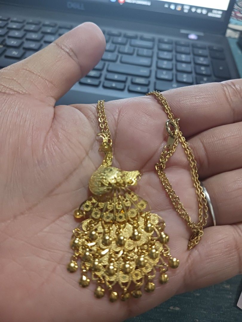 Gold-toned peacock pendant (Category: Necklaces) located in Roxas City. Submitted by tabot (Listing ID 1468979238, Image 3). Description: - From Japan surplus accessories - Very gold, no tarnished parts - Stunning gold-tone necklace featuring an intricate peacock pendant - Versatile 2-in-1 design: includes a pin mechanism on the back so it can also be worn as a brooch - Equipped with a standard link chain and a secure spring-ring clasp - Perfect 