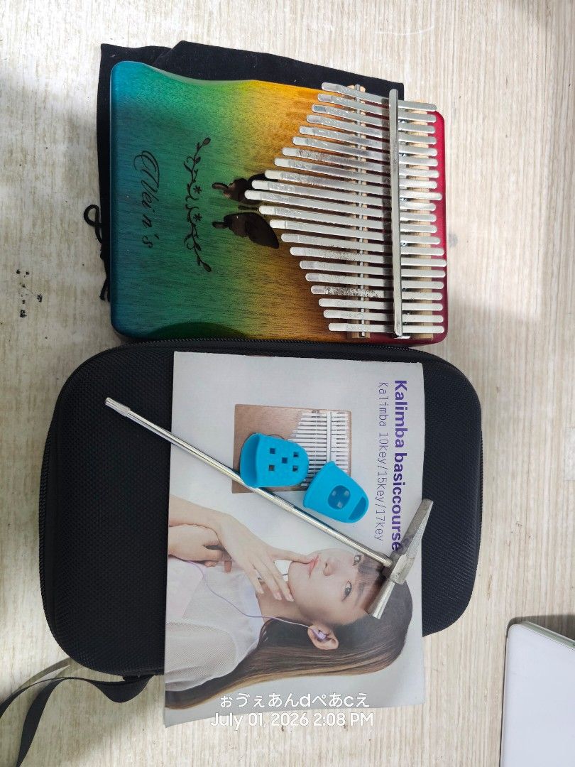 Gradient Wood Kalimba Thumb Piano with Hard Case (Category: Musical Instruments) located in Dasmarinas. Submitted by jazvielle (Listing ID 1467910661, Image 2). Description: - Instrument: 17-key wooden kalimba with pre-stamped notes and numbers - Design: Stunning blue-to-yellow gradient finish with delicate butterfly and floral laser engravings - Beginner-Friendly: Easy to pick up and play melodies quickly - Included Accessories: Black zipped har