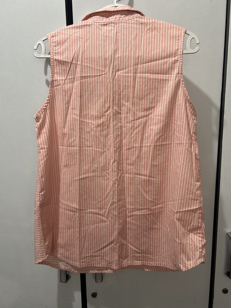 Great Expectations Striped Sleeveless Maternity Button-Down (Category: Sleeveless) located in Pasig City. Submitted by ladyleslieisletavelarde4902 (Listing ID 1469090039, Image 2). Description: A sweet and breezy sleeveless maternity top featuring mixed directional pinstripes in soft peach pink, a full button front, and a classic pointed collar. Brand: Great Expectations Maternity Tag Size: Small (S) Fabric: Lightweight, breathable 100% cotton po