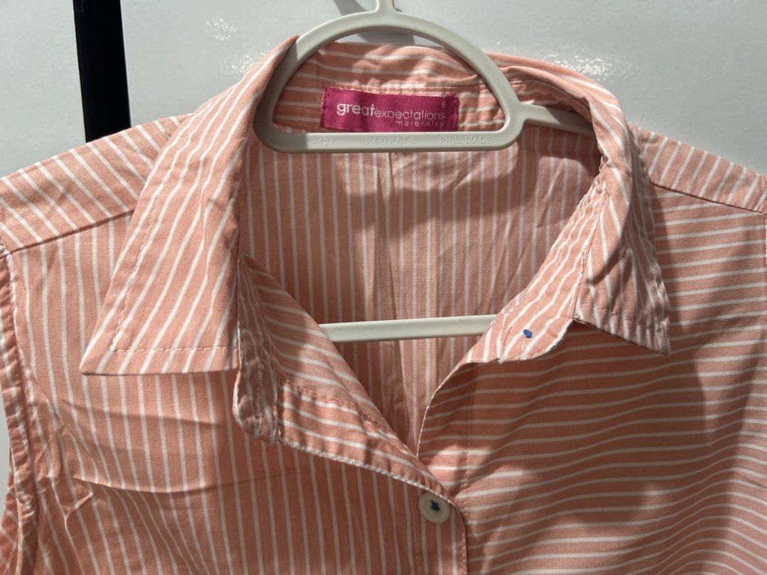 Great Expectations Striped Sleeveless Maternity Button-Down (Category: Sleeveless) located in Pasig City. Submitted by ladyleslieisletavelarde4902 (Listing ID 1469090039, Image 3). Description: A sweet and breezy sleeveless maternity top featuring mixed directional pinstripes in soft peach pink, a full button front, and a classic pointed collar. Brand: Great Expectations Maternity Tag Size: Small (S) Fabric: Lightweight, breathable 100% cotton po