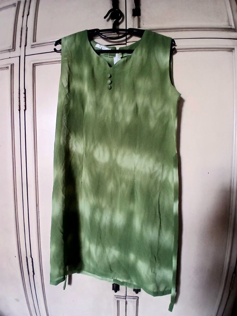 Green Tie-Dye Mini Dress (Category: Dresses) located in Manila. Submitted by f.s_prelov3d (Listing ID 1468988890, Image 2). Description: - Cute green tie-dye mini dress - Sleeveless design - Button details at the neckline - Perfect for casual outings or summer parties - Versatile styling with sandals or sneakers.