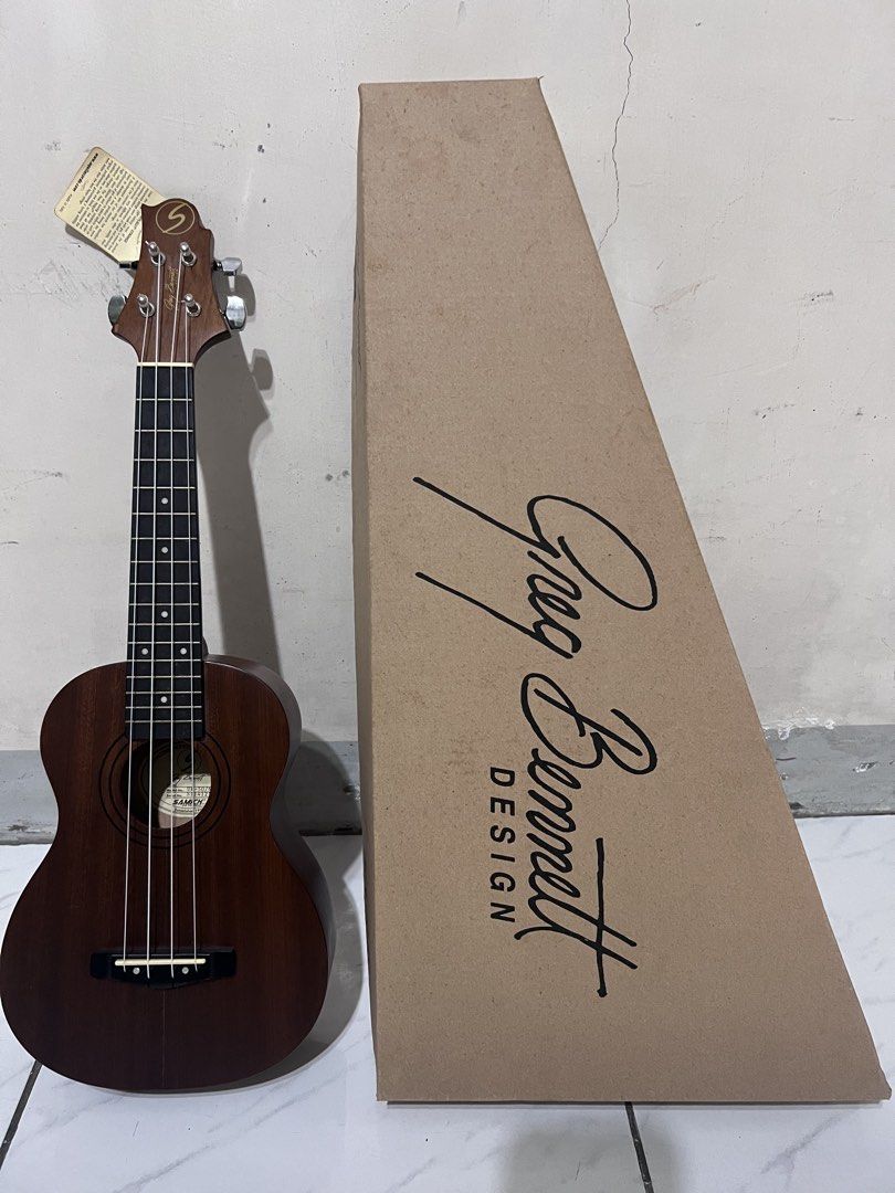 Greg Bennett Design Samick Ukulele (Category: Musical Instruments) located in Quezon City. Submitted by john7434350672 (Listing ID 1469160813, Image 1). Description: - Model: Greg Bennett Design Samick UK-507NS concert ukulele - Condition: Brand new with factory tags and QC sticker still attached - Appearance: Rich brown wood finish with a clean fretboard - Hardware: Equipped with smooth nylon strings - Inclusions: Comes complete with the origina