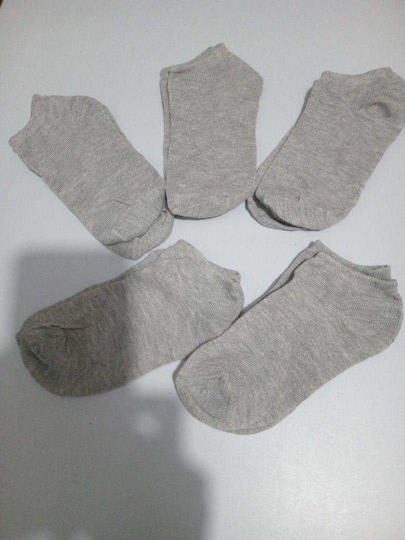Grey low-cut ankle socks pack (Category: Socks & Tights) located in Marikina City. Submitted by joyful.finds (Listing ID 1468975694, Image 1). Description: - Color: Plain grey - Cut: Low-cut, sits right below the ankle - Material: Soft cotton blend for all-day comfort . - Sizing: Standard size, fits most feet - Versatility: Great basic for everyday sneakers or loafers - Packaging: Bundle pack 120ph 5 pairs.