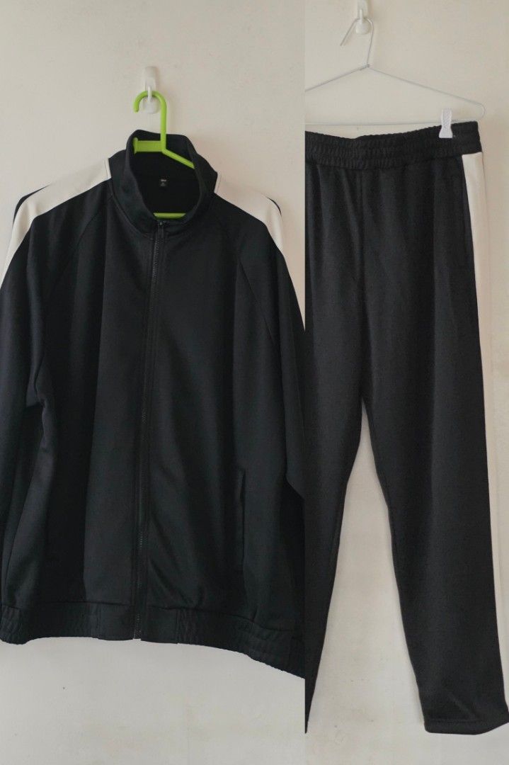 GU Black Track Jacket and Track Pants Set (Category: Activewear) located in Antipolo. Submitted by pinkpandascloset (Listing ID 1469084344, Image 3). Description: - Brand: GU - Item: Matching track jacket and track pants set - Color: Black with white side stripes - Features: Zip-front high-neck jacket, elastic waistband pants - Size: Unisex XL - Material: Comfortable fabric made with recycled materials - Style: Ideal for casual wear or workouts w
