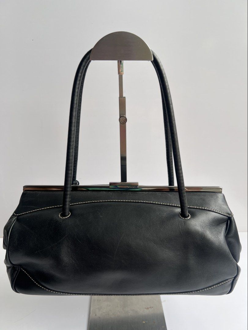 GUCCI - BLACK CLASP CLOSURE LEATHER SHOULDER BAG (Category: Luxury Bags & Wallets) located in Cavite. Submitted by _Gizmo (Listing ID 1469019316, Image 1). Description: Gucci - Clasp Closure Leather Shoulder Bag Measurement Width: 12’ Inch Height: 6’ Inch Depth: 5’ Inch Rank AB Normal sign of wear scratch on leather , rubs. Made in Italy.