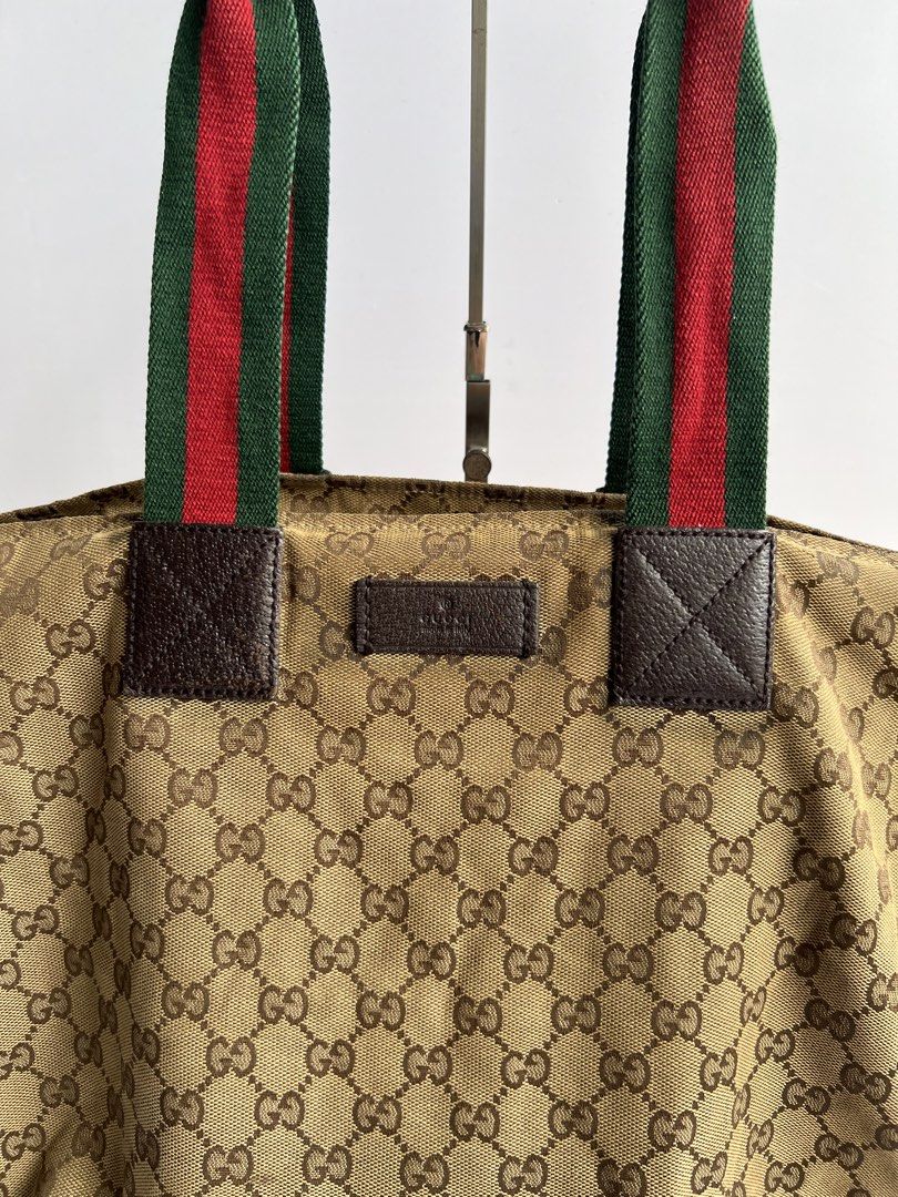 GUCCI - GG MONOGRAM WEB HANDLE TOTE BAG (Category: Tote Bags) located in Cavite. Submitted by _Gizmo (Listing ID 1469014537, Image 3). Description: Gucci - GG Monogram Web Handle Canvas Tote Bag Measurement Width: 18’ Inch Height: 12’ Inch Depth: 8’ Inch Rank B Normal sign of wear dirt on canvas, rubs. .