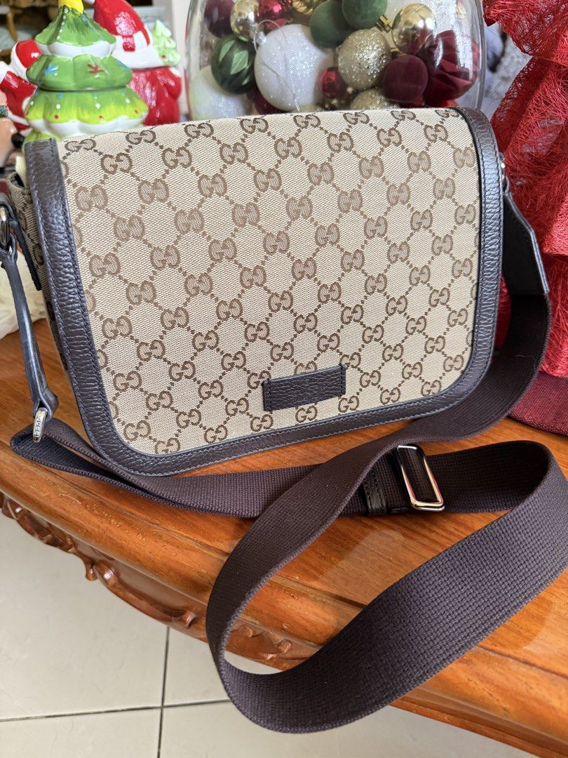 Gucci Canvas Crossbody Bag (Category: Luxury Bags & Wallets) located in San Fernando. Submitted by olliebash (Listing ID 1469109689, Image 1). Description: - Bough brand new in Japan Gucci Outlet store - With dustbag - Used few times then got stored in bag closet - Canvas is clean, no issues - Leather in magnet closure has slight discoloration - Can be unisex.