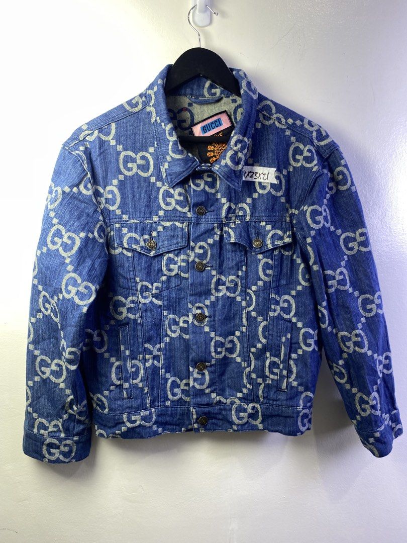 Gucci GG Denim Jacket Blue Size S (Category: Coats, Jackets and Outerwear) located in Manila. Submitted by declutterpromax (Listing ID 1468997475, Image 1). Description: - Brand: Gucci - Item: Blue Denim Jacket with All-Over White GG Monogram - Size: Small - Condition: Excellent / Like New - Details: Metallic logo buttons, two chest flap pockets, two side pockets, classic collar - Special Feature: Unique pineapple graphic inner neck label reading