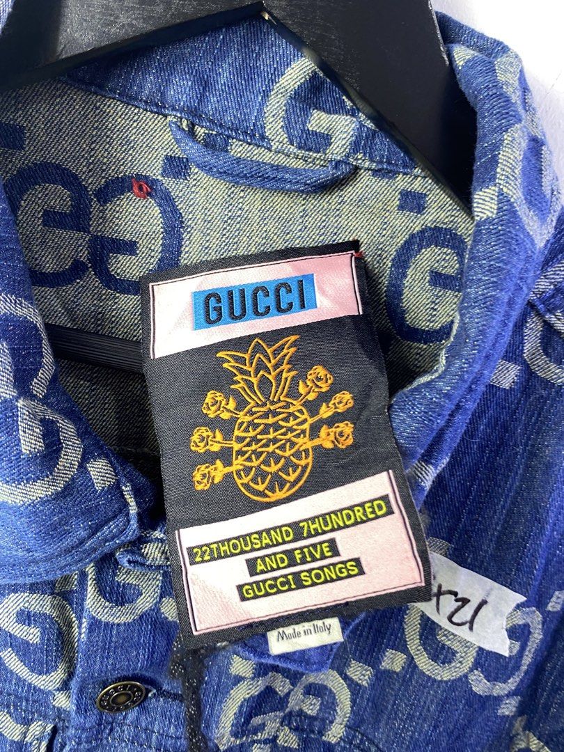 Gucci GG Denim Jacket Blue Size S (Category: Coats, Jackets and Outerwear) located in Manila. Submitted by declutterpromax (Listing ID 1468997475, Image 2). Description: - Brand: Gucci - Item: Blue Denim Jacket with All-Over White GG Monogram - Size: Small - Condition: Excellent / Like New - Details: Metallic logo buttons, two chest flap pockets, two side pockets, classic collar - Special Feature: Unique pineapple graphic inner neck label reading