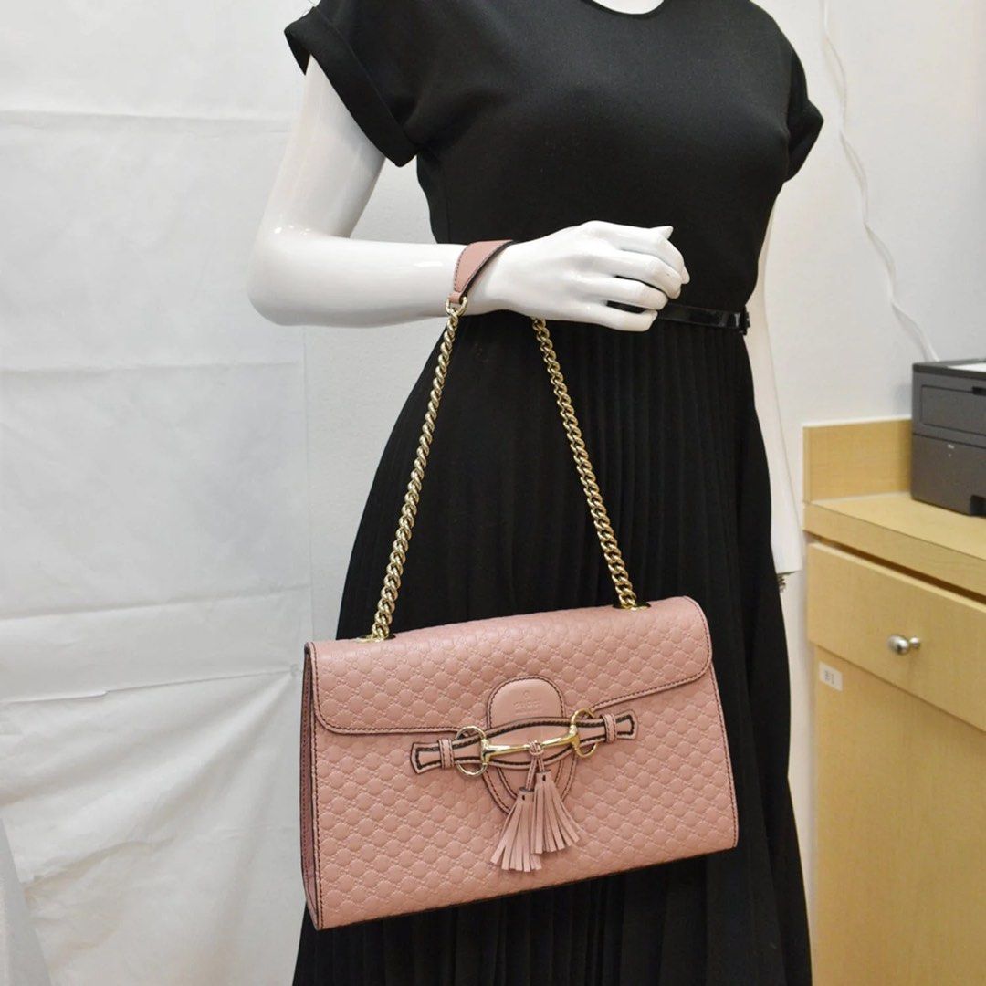 Gucci Guccissima Pink Shoulder Bag (Medium) (Category: Luxury Bags & Wallets) located in Pasig City. Submitted by bitofahoarder (Listing ID 1468967972, Image 2). Description: Gucci shoulder bag in pink micro guccissima leather. Gold-tone chain strap and hardware, horsebit detail, leather tassels on the front flap. Interior organization with standard compartments. Original dust bag and product card included. Very slight crease on the inside of the