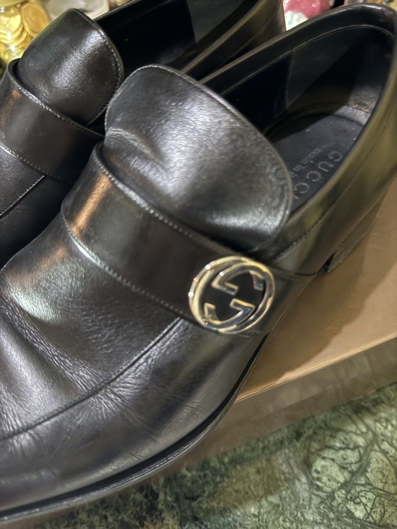 Gucci Lifford Interlocking G Leather Loafers (Category: Dress Shoes) located in Manila. Submitted by rojotesoro (Listing ID 1469119222, Image 3). Description: - Brand: Gucci - Style: Black leather slip-on loafers with square toe and stacked heel - Hardware: Silver-tone Interlocking G strap across the front - Condition: Well-maintained upper leather with natural creases from wear; sturdy rubber sole - Inclusions: Original branded box, dust wrapper
