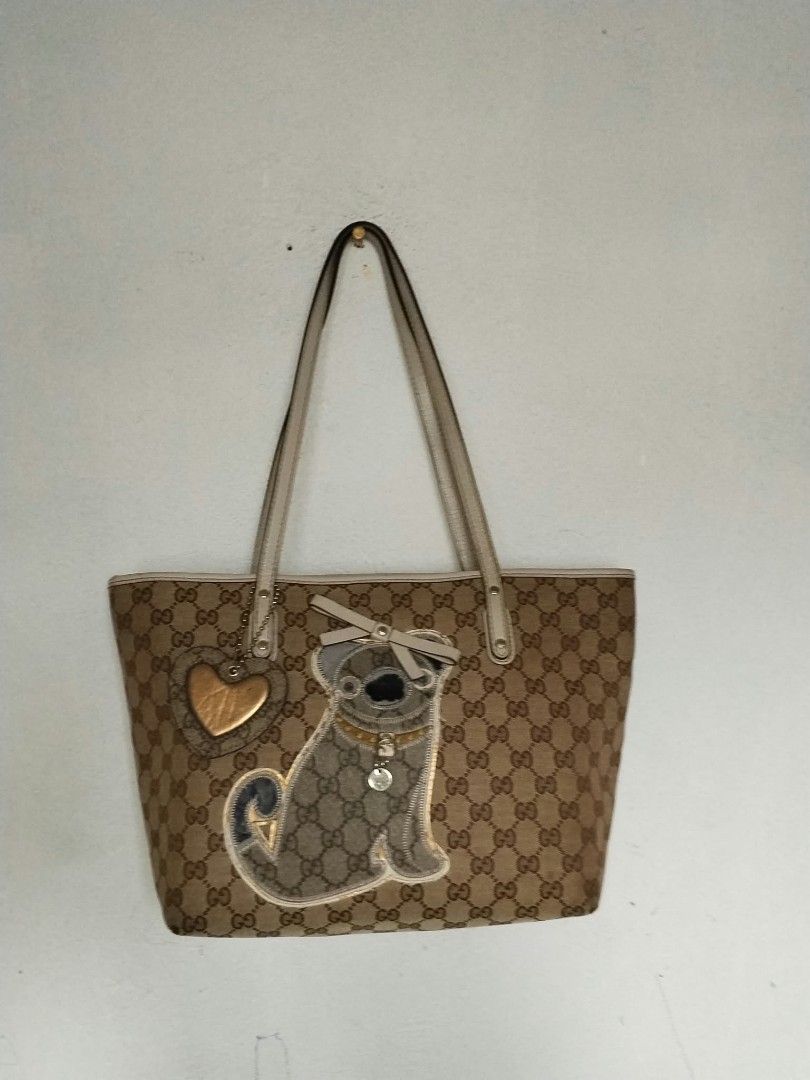 Gucci tote (Category: Tote Bags) located in Manila. Submitted by bagelyascollection (Listing ID 1468966144, Image 1). Description: Gucci tote signature canvas dog design in front.