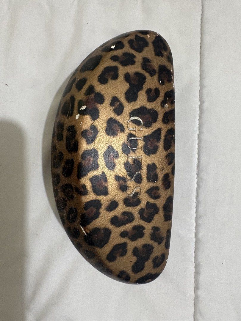 GUESS GU7401 Polarized Sunglasses with Case (Category: Sunglasses & Eyewear) located in Manila. Submitted by nykji96 (Listing ID 1468952342, Image 1). Description: - Brand/Model: Guess Polarized Sunglasses (GU7401 01D, 56-16-135 3P) - Color: Classic Black frame with polarized lenses - Condition: Lenses and frames are spotless and clean - Inclusion: Original hard glasses case featuring a stylish metallic gold leopard print pattern - Case Condition