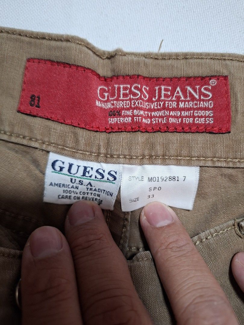 Guess Jeans Brown Pants Size 33 (Category: Coats, Jackets and Outerwear) located in Baguio. Submitted by restyrille77846 (Listing ID 1468979328, Image 3). Description: - Brand: Guess Jeans - Color: Brown - Size: Tagged size 33 - Material: 100% Cotton - Closure: Classic button fly with brand-stamped metal rivets - Details: Red brand label near the waistband - Fit: Straight leg cut, perfect for casual everyday wear.