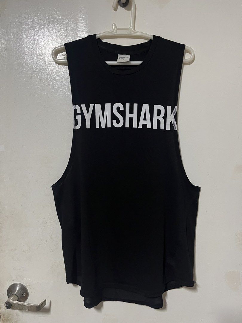 Gymshark Big Logo Tank Top Size (Category: Activewear) located in Quezon City. Submitted by oldbutgold1995 (Listing ID 1469108784, Image 1). Description: - Authentic Gymshark tank top in classic black - Bold white Gymshark logo across the chest - Size: Medium - Material: Comfortable, lightweight, and breathable cotton blend - Design: Sleeveless with a standard crew neckline, ideal for workouts - Easy to wash and maintain.
