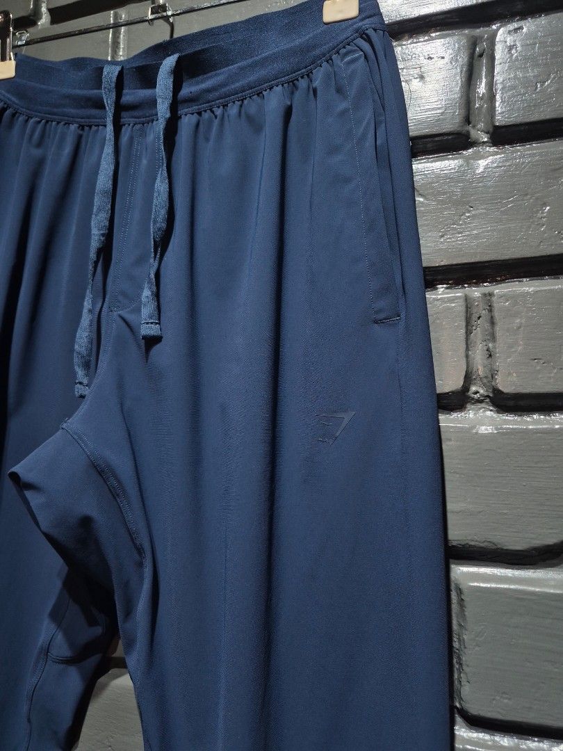 Gymshark Navy Blue Joggers Size S (Category: Other Bottoms) located in Davao. Submitted by rodrigoani57168 (Listing ID 1468937272, Image 3). Description: - GYMSHARK navy blue joggers - Adjustable drawstring waistband. - Side pockets - Cuffed ankles. - Small Gymshark logo on the left hip. - Made in Cambodia. - Lightweight athletic material. - Great for workouts or lounging around the house. - - Clean, Excellent condition. - Item description: (Pict