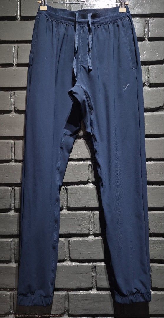 Gymshark Navy Blue Joggers Size S (Category: Other Bottoms) located in Davao. Submitted by rodrigoani57168 (Listing ID 1468937272, Image 2). Description: - GYMSHARK navy blue joggers - Adjustable drawstring waistband. - Side pockets - Cuffed ankles. - Small Gymshark logo on the left hip. - Made in Cambodia. - Lightweight athletic material. - Great for workouts or lounging around the house. - - Clean, Excellent condition. - Item description: (Pict