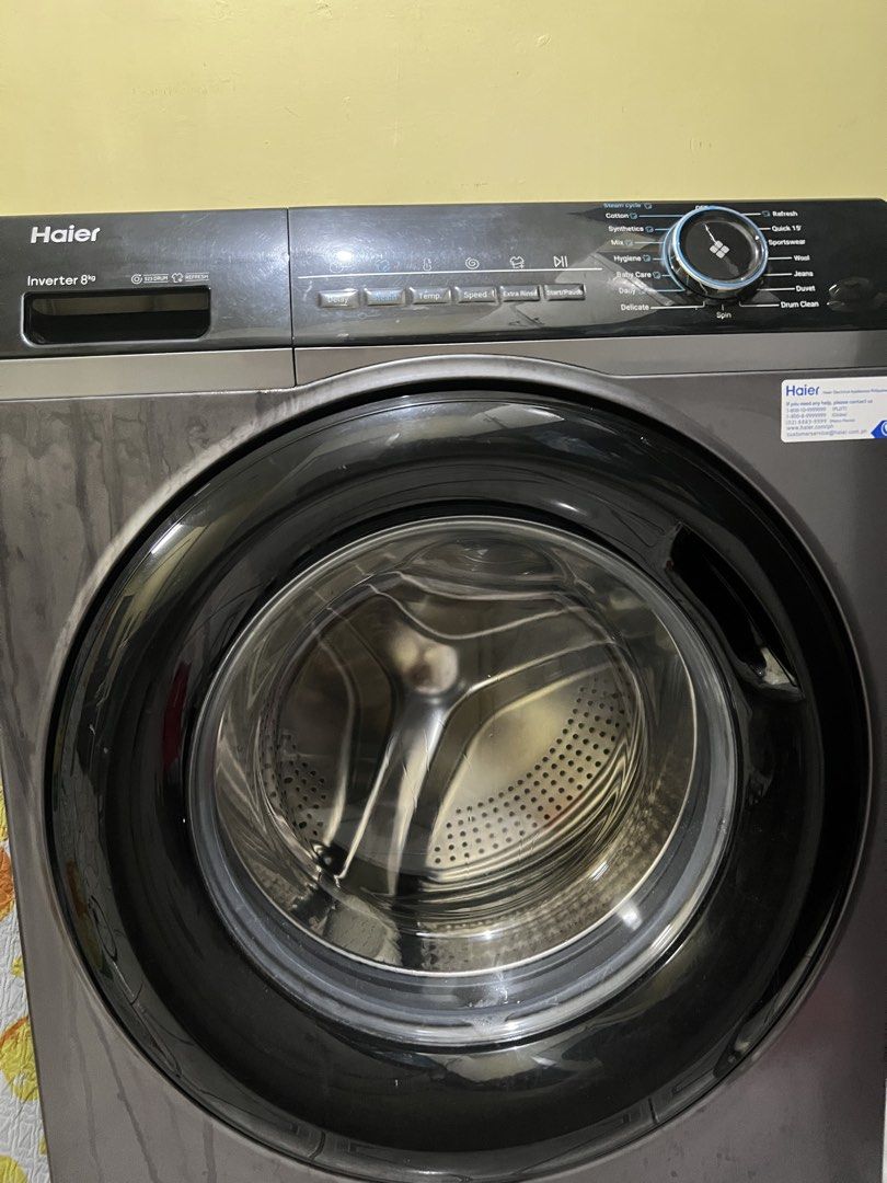 Haier Inverter 8kg Front Load Washing Machine (Category: Washing Machines and Dryers) located in Pasig City. Submitted by lucky.avalonchanel (Listing ID 1468992269, Image 3). Description: - Brand/Model: Haier Front Load Washing Machine - Capacity: 8kg (Heavy duty for daily loads) - Color: Dark grey with wide-opening glass door - Motor: Built-in inverter motor (energy-efficient) - Display & Cycles: Digital display panel with Cotton, Synthetics, Wo
