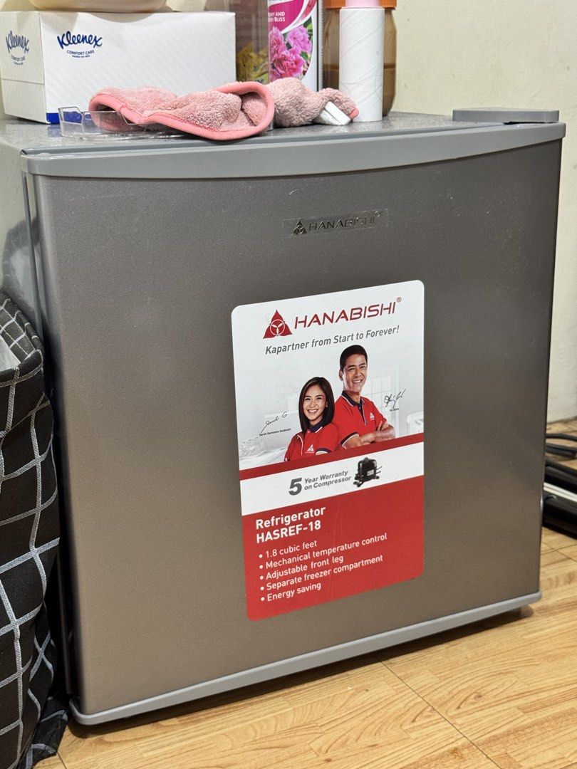Hanabishi HASREF-18 Mini Refrigerator (Category: Refrigerators and Freezers) located in Valenzuela. Submitted by jjojacola (Listing ID 1468983380, Image 1). Description: - Brand/Model: Hanabishi HASREF-18 - Capacity: 1.8 cubic feet with separate freezer compartment - Control: Mechanical temperature control with adjustable front leg - Power: 230V, 60Hz, 78W (uses eco-friendly R600a refrigerant) - Design: Space-saving, lightweight at 13.6kg - Ideal