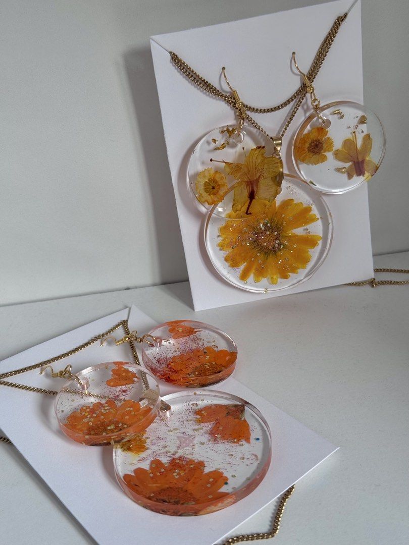 Handmade pressed flower jewelry sets and accessories (Category: Necklaces) located in Pasay City. Submitted by saroosss (Listing ID 1469087306, Image 3). Description: - Handmade clear resin jewelry and hair accessories - Encapsulates real pressed flowers with delicate glitter accents - Finished with premium gold or silver hardware - Ideal as a thoughtful gift or charming daily accessory - Message me to pick your favorite individual piece or set H