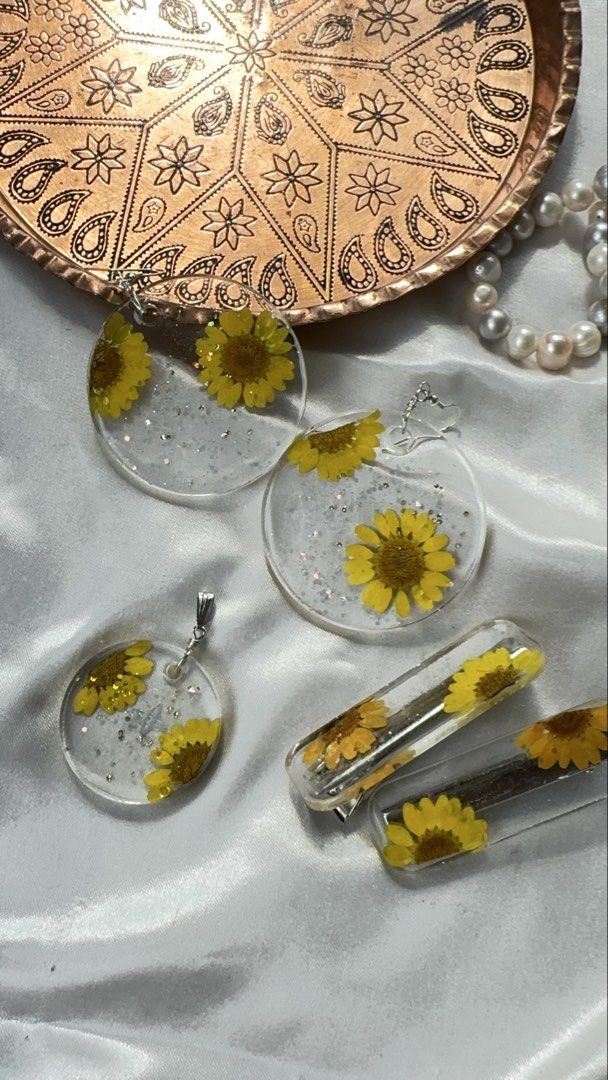 Handmade pressed flower jewelry sets and accessories (Category: Necklaces) located in Pasay City. Submitted by saroosss (Listing ID 1469087306, Image 1). Description: - Handmade clear resin jewelry and hair accessories - Encapsulates real pressed flowers with delicate glitter accents - Finished with premium gold or silver hardware - Ideal as a thoughtful gift or charming daily accessory - Message me to pick your favorite individual piece or set H