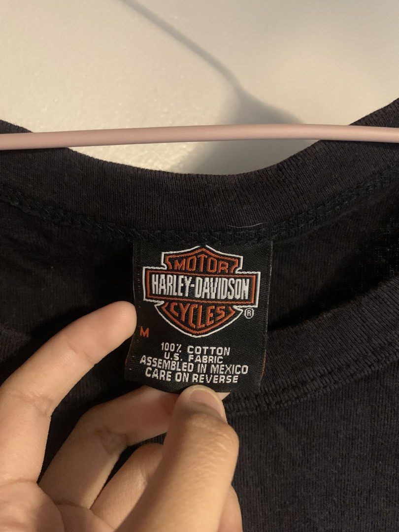 Harley-Davidson Rhinestone Logo Black T-Shirt Medium (Category: Shirts) located in Andop. Submitted by isha.ae (Listing ID 1468978826, Image 3). Description: - Authentic Harley-Davidson black graphic tee - Size: Medium - Eye-catching rhinestone lettering on the front - Scoop neckline with short sleeves - Material: 100% soft cotton - Care: Machine wash cold on delicate cycle - Condition: Excellent, with original De-lux merchandise tag - HD JAPAN.