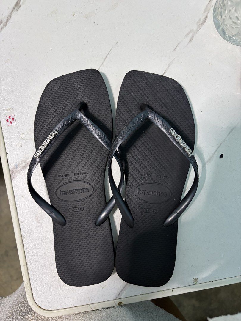 Havaianas Black Square Toe Flip Flops Size 39-40 (Category: Slippers and slides) located in Malolos. Submitted by its_marychrist (Listing ID 1469100567, Image 1). Description: - Brand: Havaianas - Color: Classic Black - Style: Trendy square toe design - Size: US 9/10 | EUR 41/42 | BR 39-40 - Condition: Pre-loved, normal dirt/wear on soles, straps and studs are 100% intact - Features: Textured footbed for non-slip comfort, iconic branded straps - 