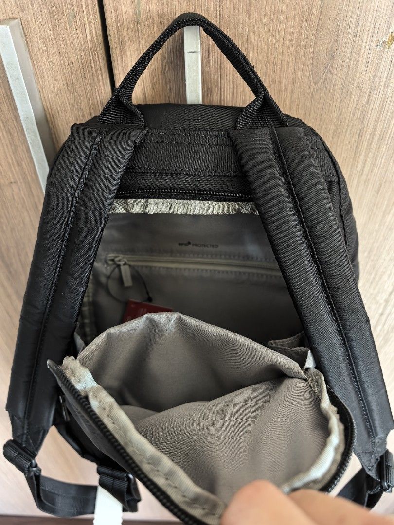 Hedgren Black Backpack RFID Protected (Category: Backpacks) located in Manila. Submitted by maifabfinds (Listing ID 1468968039, Image 2). Description: - Brand: Hedgren - Color: Black - Condition: Brand new, never used, with original tags attached - Straps: Adjustable shoulder straps with protective wrapping still intact - Exterior: Front zip pocket and convenient top handle - Interior: RFID-protected zipper pocket and slip compartments for secure