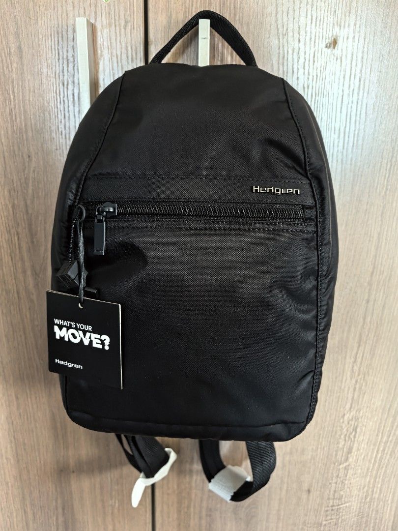 Hedgren Black Backpack RFID Protected (Category: Backpacks) located in Manila. Submitted by maifabfinds (Listing ID 1468968039, Image 3). Description: - Brand: Hedgren - Color: Black - Condition: Brand new, never used, with original tags attached - Straps: Adjustable shoulder straps with protective wrapping still intact - Exterior: Front zip pocket and convenient top handle - Interior: RFID-protected zipper pocket and slip compartments for secure