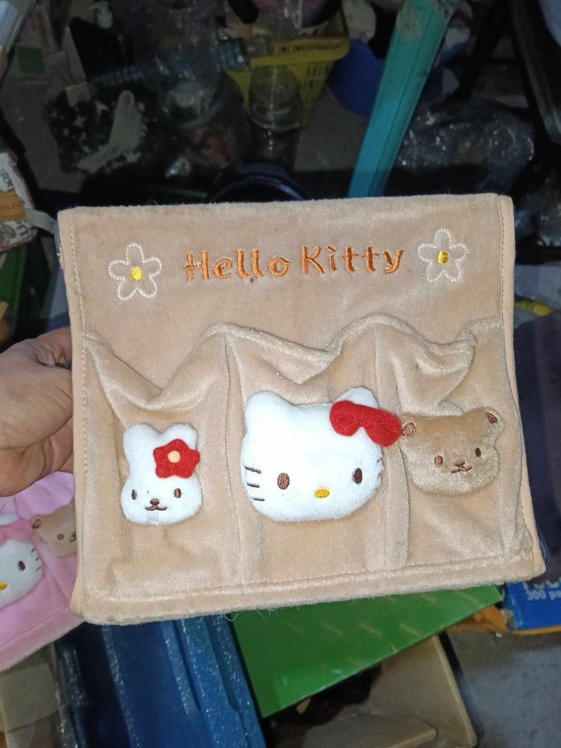 Hello Kitty Hanging Storage Organizer with Pockets (Category: Accessory Holder, Box & Organizers) located in Manila. Submitted by janetecson05 (Listing ID 1469089791, Image 1). Description: - Adorable Kitty hanging pocket organizer made with soft plush fabric - Features detailed embroidery with text and flowers - Includes 3 front pockets with cute 3D plush characters (a bunny, Kitty, and a bear) - Equipped with a sturdy collapsible metal frame st
