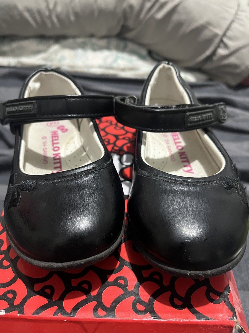 Hello Kitty School Shoes Black Size 27 (Category: Babies & Kids Fashion) located in Las Pinas. Submitted by freeowl_eb0f7b (Listing ID 1468942836, Image 2). Description: - Brand: Hello Kitty - Model: SF1168 - Size: 27 - Color: Black - Features: Adjustable top strap with a subtle Kitty side detail - Condition: Great for school uniforms or formal events - Packaging: Includes original red box - Original Retail Price: P1,299.