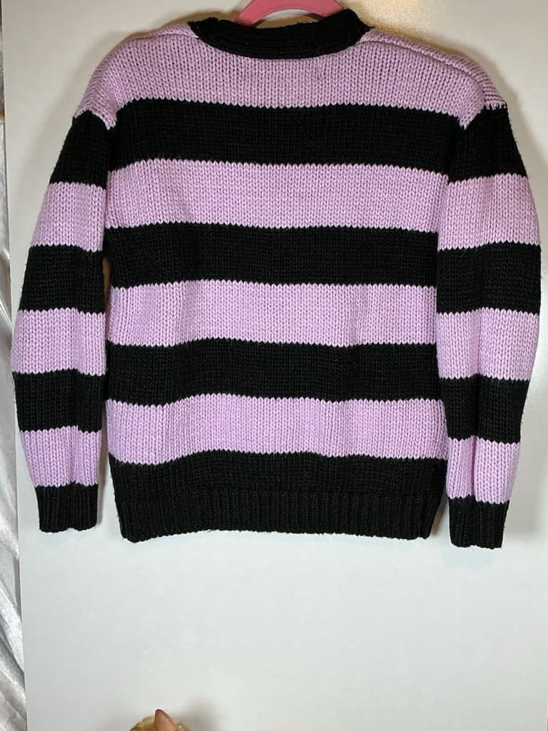 Hello Kity x friends sweeter (Category: Coats, Jackets and Outerwear) located in Manila. Submitted by icamalicdem29 (Listing ID 1469061106, Image 2). Description: Sanrio Kuromi black and purple striped V-neck button-down cardigan (featuring a Kuromi character patch on the chest), which has been released through collaborations such as Forever 21 x Hello Kitty and Friends..