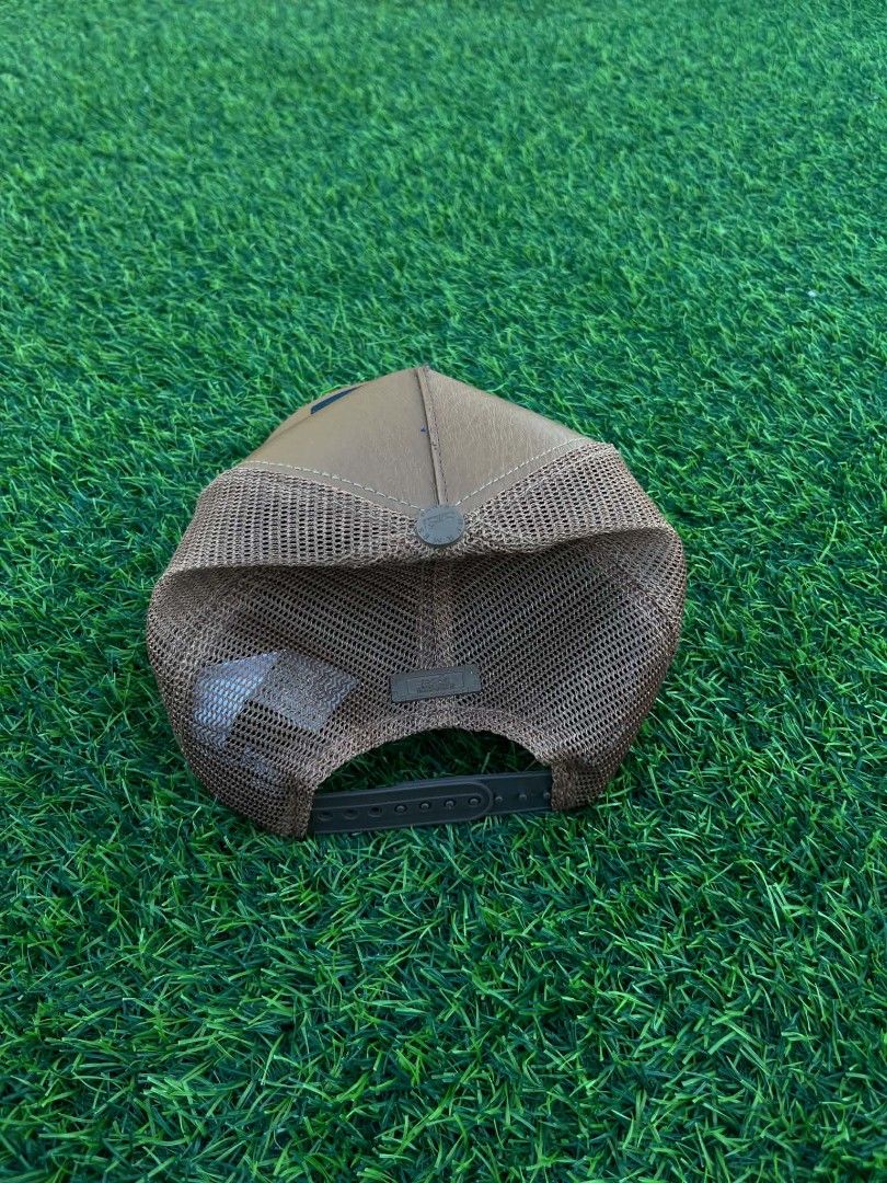 Hermes Brown Leather H Logo Trucker Hat Cap (Category: Caps & Hats) located in Pasig City. Submitted by paulclzdo (Listing ID 1469064972, Image 2). Description: - Style: Classic trucker hat - Front: Brown faux leather with black embroidered H logo - Back: Breathable mesh with adjustable snapback closure - Interior: Hermès branded sweatband taping and care tag - Condition: Great piece to elevate your daily outfits - Shipping or meetups available a