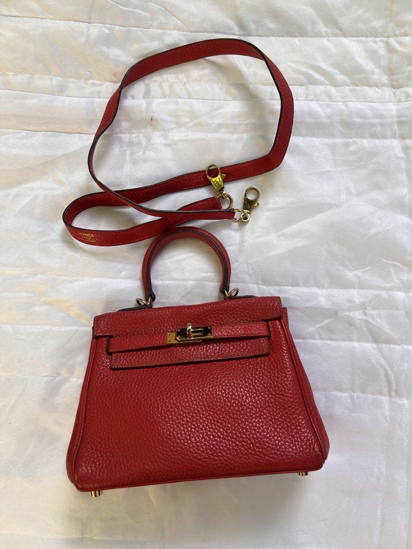 Hermes Red Leather Mini Handbag with Strap (Category: Luxury Bags & Wallets) located in Quezon City. Submitted by rizza14ortiz (Listing ID 1469012318, Image 2). Description: - Elegant gold tone hardware with secure turn-lock closure - Structured top handle design plus a matching detachable shoulder strap - Luxurious red leather interior complete with a handy slip pocket - Protective metal feet on the bottom base - Condition: Minor signs of wear o