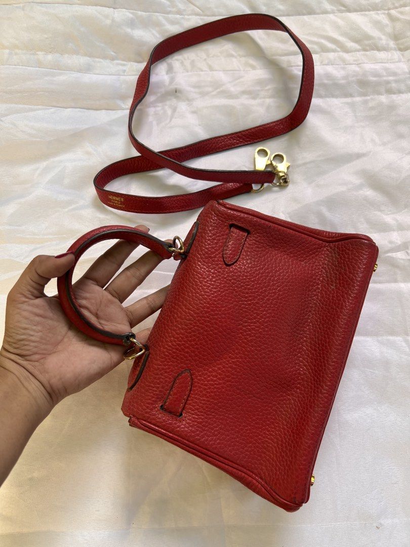 Hermes Red Leather Mini Handbag with Strap (Category: Luxury Bags & Wallets) located in Quezon City. Submitted by rizza14ortiz (Listing ID 1469012318, Image 3). Description: - Elegant gold tone hardware with secure turn-lock closure - Structured top handle design plus a matching detachable shoulder strap - Luxurious red leather interior complete with a handy slip pocket - Protective metal feet on the bottom base - Condition: Minor signs of wear o