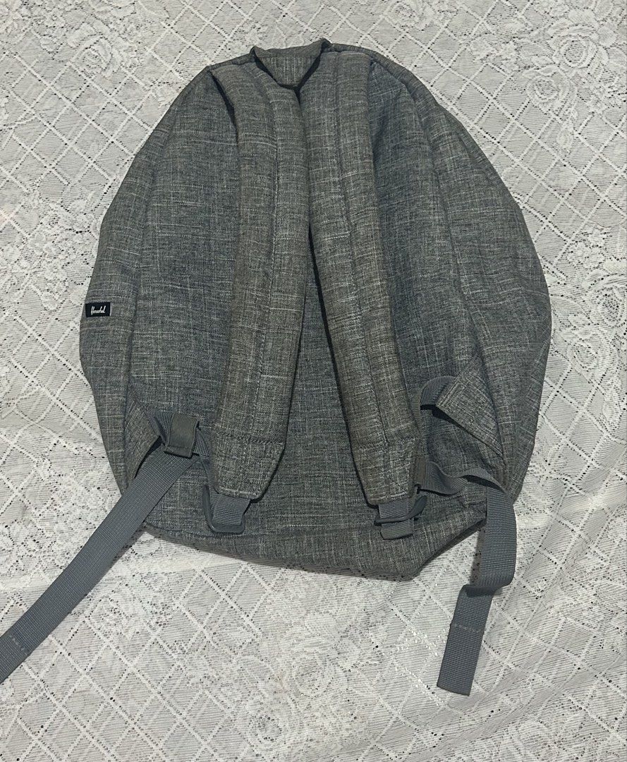Herschel Supply Co. Grey Backpack (Category: Backpacks) located in Plaridel. Submitted by ilovebubu28 (Listing ID 1468959829, Image 3). Description: - Authentic Herschel backpack in a versatile grey heather colorway - Front zippered pocket with branded metal pulls for easy access - Spacious main compartment with secure dual-zipper closure - Adjustable shoulder straps with padded support for daily comfort - Classic woven Herschel label on the fron
