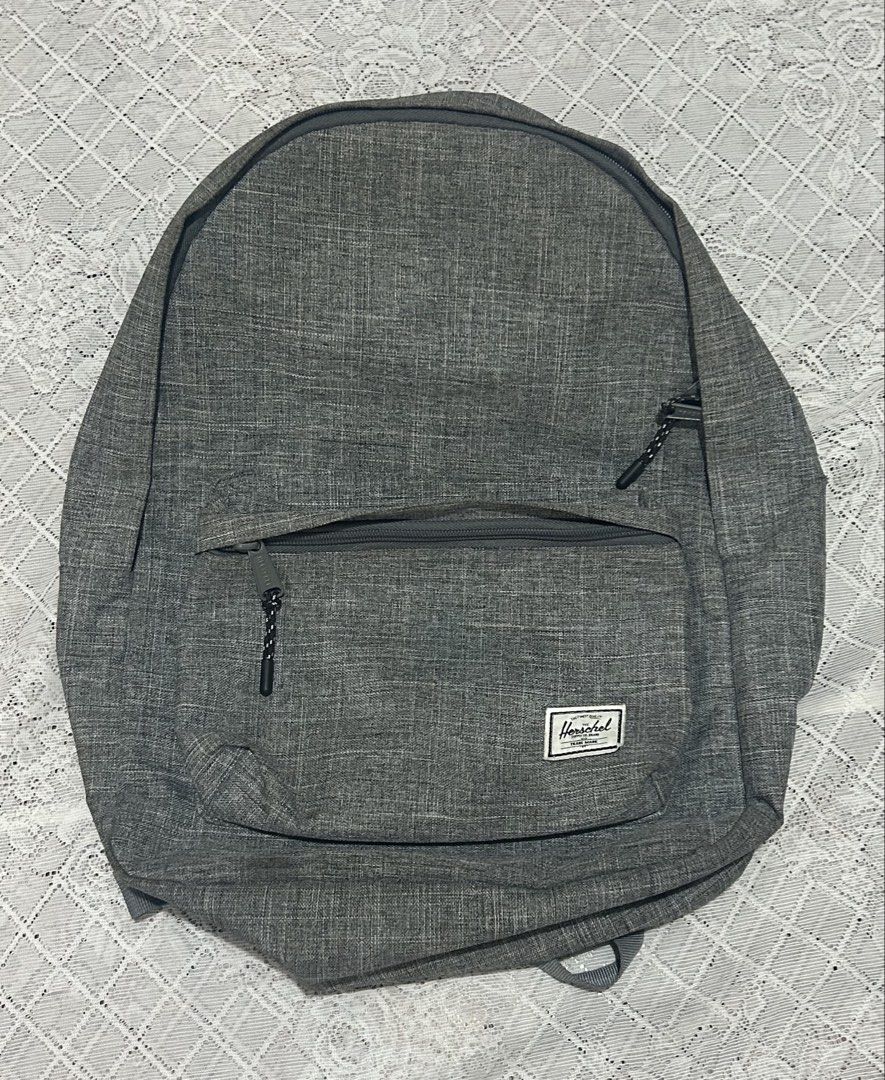 Herschel Supply Co. Grey Backpack (Category: Backpacks) located in Plaridel. Submitted by ilovebubu28 (Listing ID 1468959829, Image 2). Description: - Authentic Herschel backpack in a versatile grey heather colorway - Front zippered pocket with branded metal pulls for easy access - Spacious main compartment with secure dual-zipper closure - Adjustable shoulder straps with padded support for daily comfort - Classic woven Herschel label on the fron