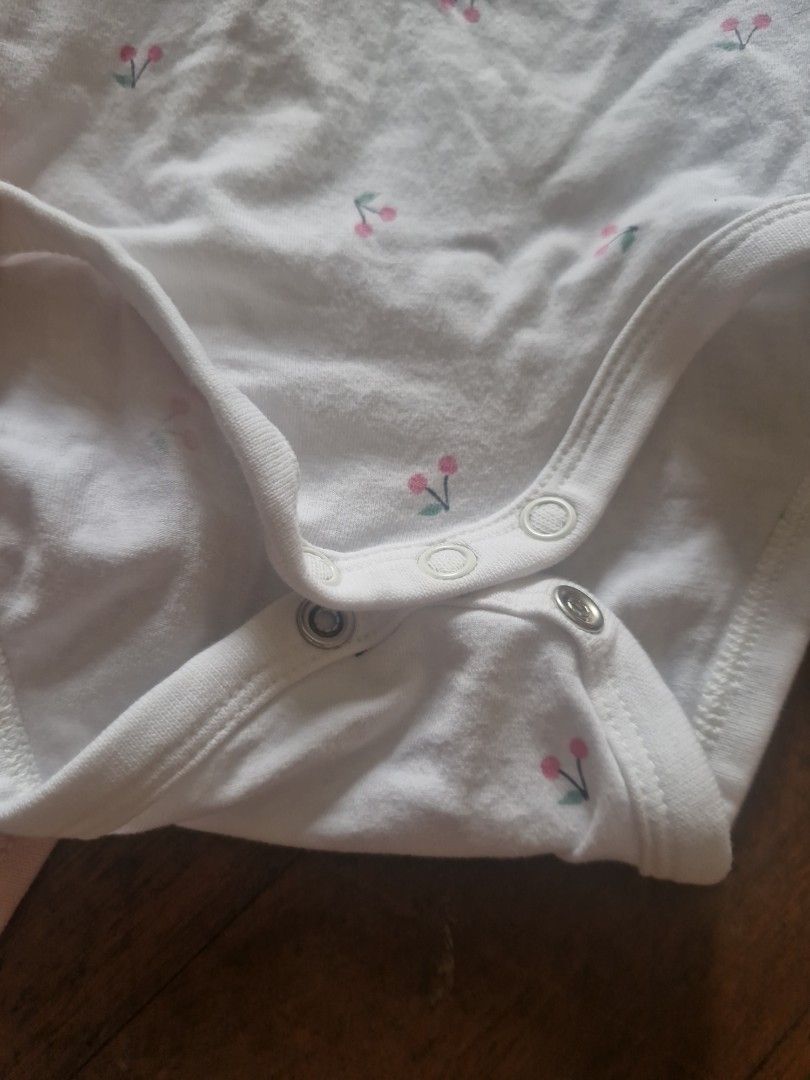 H&M Basic Organic Cotton Baby Bodysuits And Bloomer Set (Category: Babies & Kids Fashion) located in Cebu City. Submitted by minimi.cebu (Listing ID 1468934476, Image 2). Description: - Brand: H&M Basic - Size: EUR 62 / US 3M / CA 2-4M - Material: 100% organic cotton, ultra-soft and gentle on baby skin - Set includes: 1 white bodysuit with tiny cherry prints, 1 plain pink bodysuit, and 1 matching cherry print bloomer with ruffles - Features: Conv