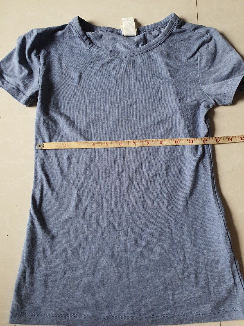 H&M Basics Blue T-shirt Size XS (Category: Shirts) located in Meycauayan. Submitted by shoptoown (Listing ID 1468936032, Image 2). Description: - Brand: H&M - Item: Basic Short Sleeve T-Shirt - Color: Blue - Size: US XS - Origin: Made in Bangladesh - Material: Soft ribbed fabric - Condition: Great casual staple piece for everyday wear - Measurements: Length and width details clearly shown in pictures.