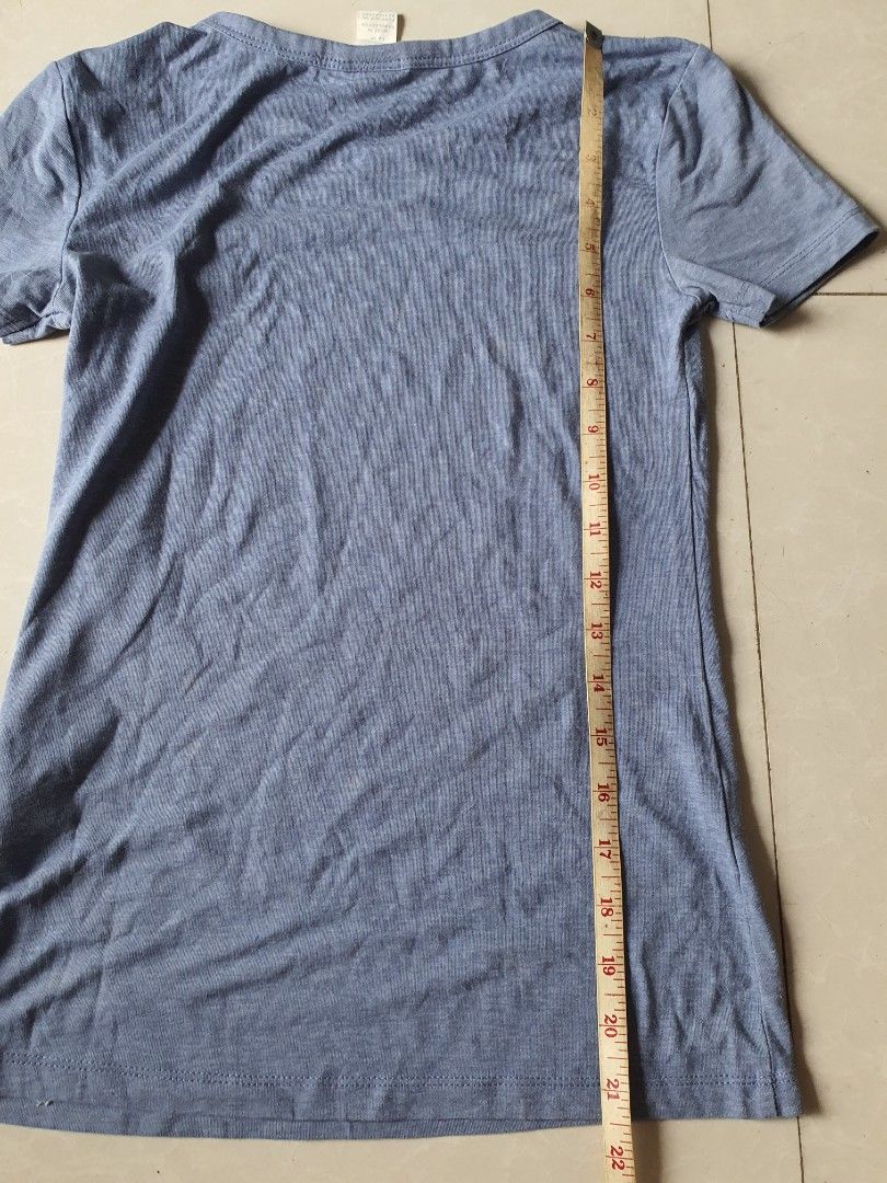 H&M Basics Blue T-shirt Size XS (Category: Shirts) located in Meycauayan. Submitted by shoptoown (Listing ID 1468936032, Image 3). Description: - Brand: H&M - Item: Basic Short Sleeve T-Shirt - Color: Blue - Size: US XS - Origin: Made in Bangladesh - Material: Soft ribbed fabric - Condition: Great casual staple piece for everyday wear - Measurements: Length and width details clearly shown in pictures.