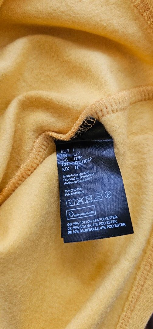 H&M Divided Yellow Colorblock Sweatshirt Size L (Category: Coats, Jackets and Outerwear) located in Antipolo. Submitted by pinkpandascloset (Listing ID 1469085607, Image 3). Description: - Brand/Style: H&M Divided colorblock sweatshirt - Size: L (170/104A tag sizing), relaxed and cropped fit - Colorway: Mustard yellow, dusty mauve, and white panels - Material: 59% cotton, 41% polyester with a soft fleece lining inside - Details: Crew neck, ribbed