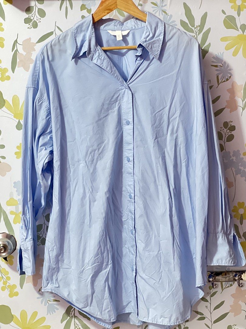 H&M Light Blue Oversized Button-Up Shirt Size M (Category: Shirts) located in Pasig City. Submitted by morilove (Listing ID 1469161569, Image 1). Description: - Brand: H&M - Color: Light Blue - Size: EUR M / US M (165/96A) - Fit: Relaxed, oversized with dropped shoulders - Material: Lightweight cotton - Features: Long sleeves, classic collar, buttoned cuffs, curved hem - Condition: Clean, excellent staple piece for layering or solo wear.