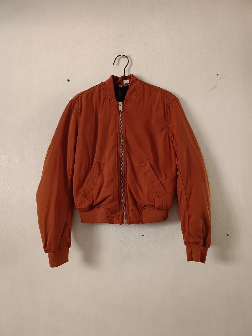 H&M Orange Reversible Bomber Jacket Black Quilted Lining (Category: Coats, Jackets and Outerwear) located in Manila. Submitted by shajanina.14 (Listing ID 1468956635, Image 2). Description: H&M Original Preloved As good as new XS- US As per measuring tape, Bust- up to 40 inches Waist- up to 38 inches Length- 21 inches .