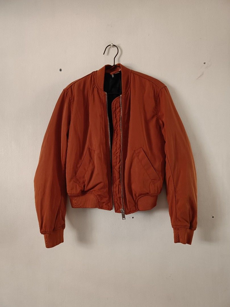 H&M Orange Reversible Bomber Jacket Black Quilted Lining (Category: Coats, Jackets and Outerwear) located in Manila. Submitted by shajanina.14 (Listing ID 1468956635, Image 3). Description: H&M Original Preloved As good as new XS- US As per measuring tape, Bust- up to 40 inches Waist- up to 38 inches Length- 21 inches .
